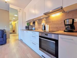 Kuchyň nebo kuchyňský kout v ubytování Scandian Apartments - City Hub Tallinn