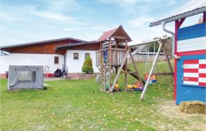 a playground in the yard of a house at Nice Apartment In Gräfendorf in Gräfendorf