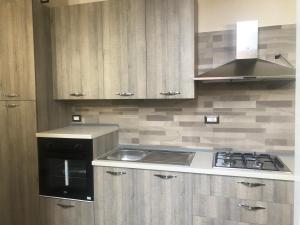 A kitchen or kitchenette at FORIA 58 APARTAMENTS Még 19 kép