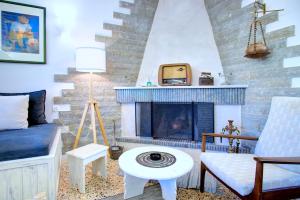 Posedenie v ubytovaní Kanakades Olive Cottage