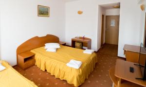 Postel nebo postele na pokoji v ubytování Hotel Atlantis