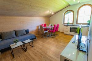 a living room with a couch and a table at Huberhof 9 by Alpenidyll Apartments in Schladming