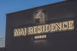 a sign on the side of a building that reads mat residence at Maj Luxury Residence in Poreč
