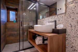 a bathroom with a sink and a shower at Old Spalatrum Luxury Rooms in Split +58 photos