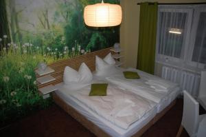 En eller flere senge i et værelse på CASILINO Hotel A 24 Wittenburg