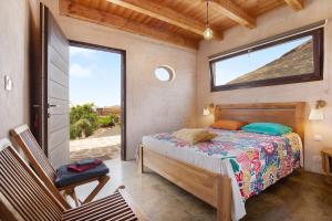 Postel nebo postele na pokoji v ubytování Tayu Eco Villa + 20 fotografií