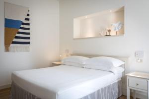 Voodi või voodid majutusasutuse Murè Hotel Numana toas