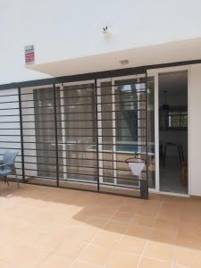 a room with sliding glass doors and a balcony at La Palmera in Estepona