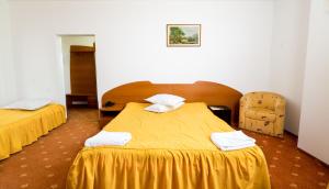 Postel nebo postele na pokoji v ubytování Hotel Atlantis