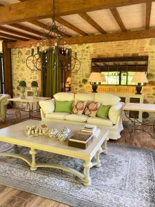 a living room with a couch and a coffee table at Il Borghetto Andrea Tafi in Lamporecchio