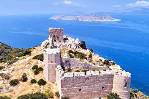 an old castle on a hill near the ocean at Makedonia Studios at Harbour of Kamiros Skala in Kamiros