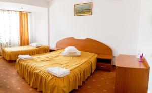 Postel nebo postele na pokoji v ubytování Hotel Atlantis