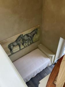 En eller flere senge i et værelse på Casa Segreta
