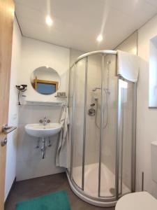 a bathroom with a shower and a sink at Haus Johanna in Westendorf +51 photos