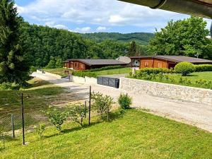 an aerial view of a farm with a fence and buildings at Holiday home Natura in Slunj