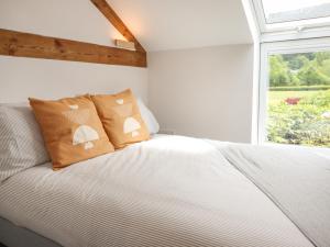 Postel nebo postele na pokoji v ubytování Little Nook