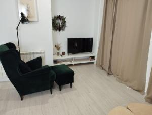 Μια τηλεόραση ή/και κέντρο ψυχαγωγίας στο VUT-HU-22-247 Fabuloso Apartamento con vistas a la montaña El Abedul Luga 23 Castiello de Jaca