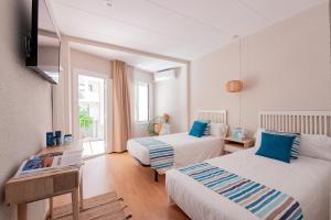Postel nebo postele na pokoji v ubytování Hotel Aubí