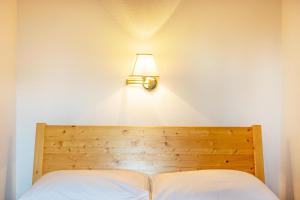 A bed or beds in a room at Ferienparadies Sabina Latsche