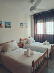 Ένα ή περισσότερα κρεβάτια σε δωμάτιο στο Casa Iqui