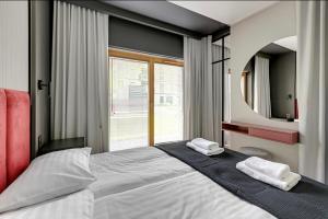 Posteľ alebo postele v izbe v ubytovaní Prestige Apart Gdańsk