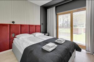 Posteľ alebo postele v izbe v ubytovaní Prestige Apart Gdańsk