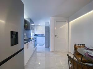 A kitchen or kitchenette at Camara Suite