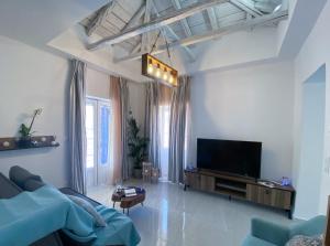 A television and/or entertainment centre at Camara Suite