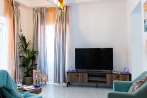 A television and/or entertainment centre at Camara Suite