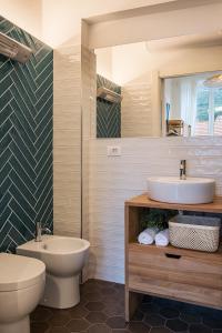 Kúpeľňa v ubytovaní Ensemble rooms di Vayadù