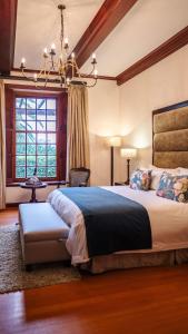 A bed or beds in a room at Meerendal Boutique Hotel