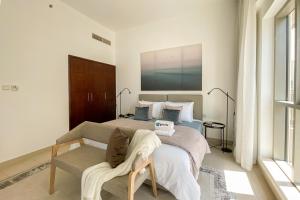 Postel nebo postele na pokoji v ubytování HiGuests - Amazing Apartment overlooking Burj Khalifa!