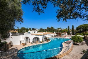 a large swimming pool in a resort at Quinta Do Paraiso - AL in Carvoeiro