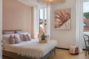 Posteľ alebo postele v izbe v ubytovaní Ensemble rooms di Vayadù
