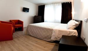 Postel nebo postele na pokoji v ubytování Hotel Cajeta