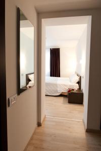 Postel nebo postele na pokoji v ubytování Hotel Cajeta