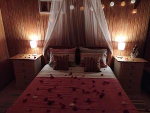 a bedroom with a bed with birds on it at Herdade da Hera in Azambuja