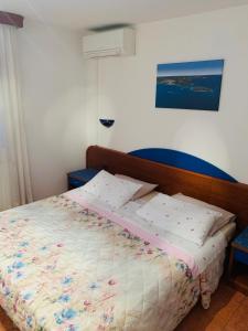 Postel nebo postele na pokoji v ubytování FUNTANA-MIA ROOMS B&B