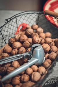 a basket full of hazelnuts with aeder at Gîte La Source in Grusse