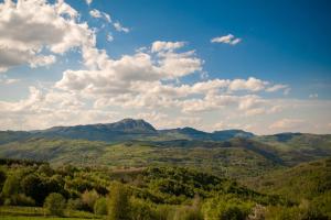 a view of a valley with mountains and clouds at Vila Angelina in Kušići