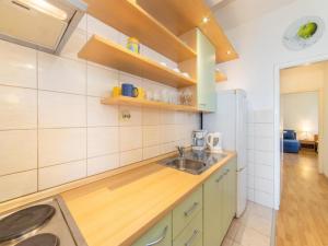 Η κουζίνα ή μικρή κουζίνα στο Apartments M&F