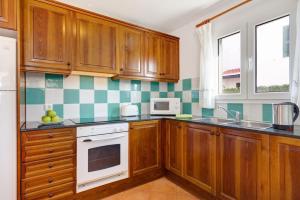A kitchen or kitchenette at Villa Noa by Villa Plus
