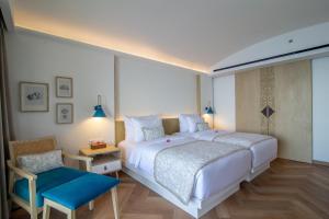 Postel nebo postele na pokoji v ubytování Royal Avila Boutique Resort