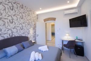 Televízia a/alebo spoločenská miestnosť v ubytovaní Villa Valverde Apartments e B&B + 34 fotografií