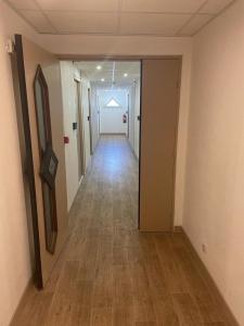 an empty hallway of an office building with a long corridor at Lemon Hotel Plan de Campagne Marseille in Septèmes-les-Vallons