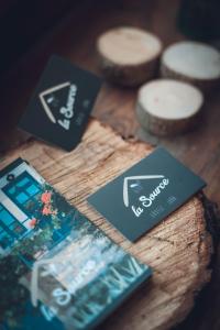 a wooden table with labels on top of a table at Gîte La Source in Grusse