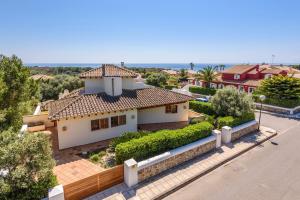 an aerial view of a house with the ocean in the background at Villa Xoric by Villa Plus in Son Xoriguer