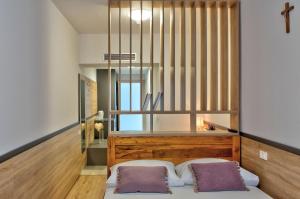 Postel nebo postele na pokoji v ubytování Hotel Dompes