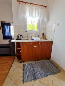 Kuchyň nebo kuchyňský kout v ubytování Apartments Silvana