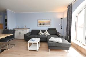 Ein Sitzbereich in der Unterkunft "Appartementhaus Deichgraf" Appartement D450